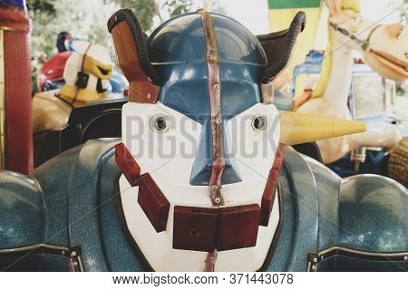 Close Up Of A Vintage Robot On Carousel At Abandoned Theme Park. Post Apocalyptic Concept. The Day A