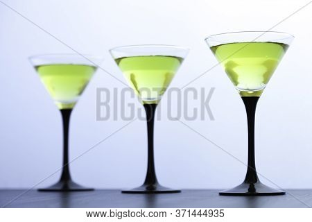 Yellow Cocktails Glasses In Line