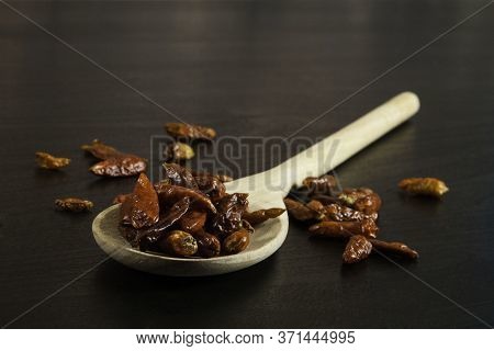 Red Hot Peppers In Wooden Spoon