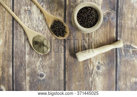 Black Peppercorns And Ground Black Pepper