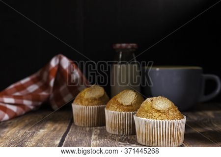 Three Delicious Cupcakes On Black