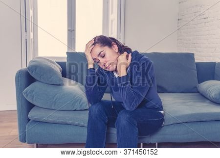 Young Lonely Attractive Latin Woman Crying On Couch Feeling Sad Tired And Worried Suffering Depressi