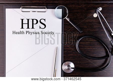 Hps Text Written In A Notebook Lying On A Desk And A Stethoscope. Medical Concept.