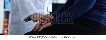 Male Doctor Reassures Patient After Examination. Memory Problems And Fainting. Diagnosis Malignant N