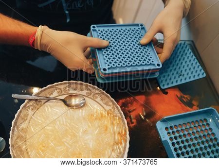 Mans Hands In Gloves Making Home Made Pills And Vitamins With Organic Turmeric Powder Using Special 