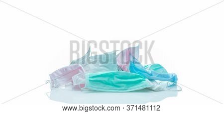 Pile Of Used Surgical Face Mask Isolated On White Background. Medical Waste. Infectious Waste From C