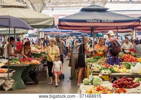 Osijek, Croatia - August 26, 2017: Traditional Scene Of The Osijek Green Market With A Crowd Of Peop