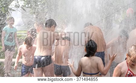 Gomel, Belarus - June 10, 2020: Children Bathe In A Fountain In The Park Gromyko