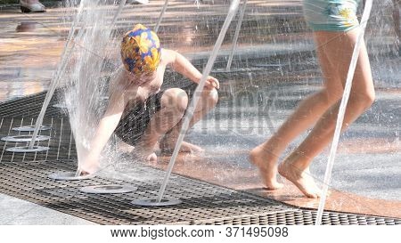 Gomel, Belarus - June 10, 2020: Children Bathe In A Fountain In The Park Gromyko