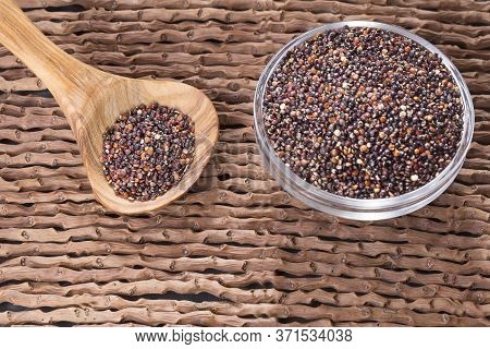 Black Quinoa Seeds - Chenopodium Petiolare. Wood Background