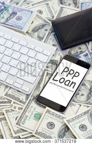 Keyboard And Modern Phone With Copy Space On Screen On Money Background, Paycheck Protection Program