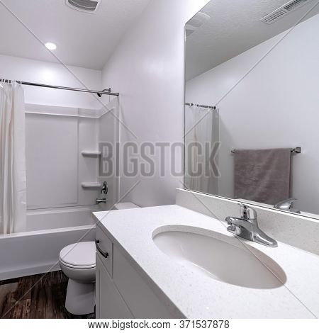 Square Crop Clean White Bathroom Interior With Oval Sink Mirror Toilet Bathtub And Shower