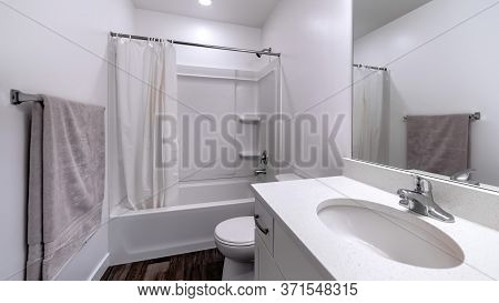 Panorama Clean White Bathroom Interior With Oval Sink Mirror Toilet Bathtub And Shower