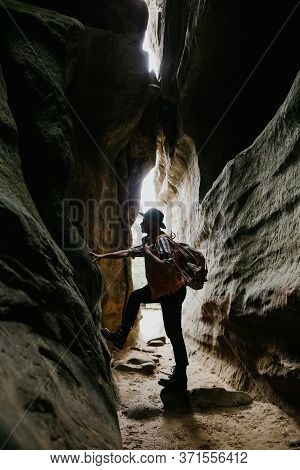 Amateur Geologist And Speleologist Explores A Mountain Cave. Extreme Hobbies