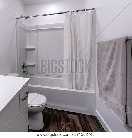 Square Clean White Bathroom Interior With Oval Sink Mirror Toilet Bathtub And Shower
