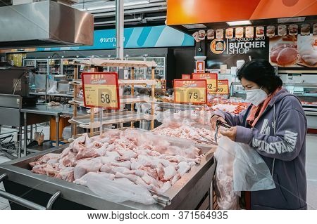 Bangkok, Thailand - June 15, 2020 : Asian Senior Old Woman Wearing Hygiene Face Mask Choosing And Sh