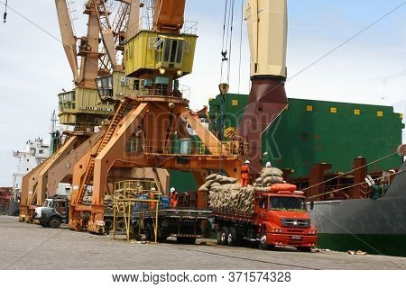 Ilheus, Bahia / Brazil - March 26, 2012: Workers Are Seen Disembarking Cocoa Beans At The Port Of Il