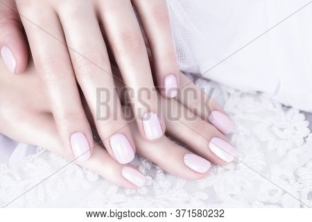 Nude Nail Polish. Beige Manicure With Pearls On A White Background.