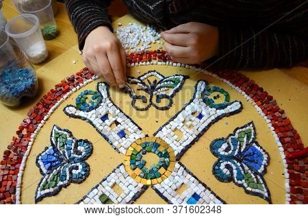Female Hands With Tweezers Spread A Picture Of Smalt In A Mosaic Workshop. Capacities With Smalt. Ma