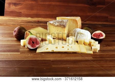 Different Sorts Of Cheese. Cheese Platter With Different Cheese And Spice