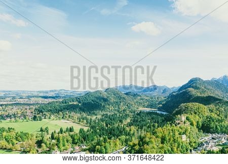 Beautiful Nature Of European Alps, Landscape View Of Alpine Mountains, Lake And Village In Spring Se