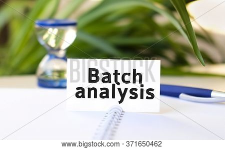 Batch Analysis Seo Business Concept Text On A White Notebook And Hourglass, Blue Pen, Green Flowers