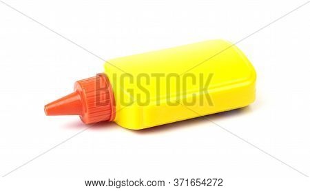 A Tube Of Yellow Stationery Glue For Paper Isolated On A White Background. School Supplies
