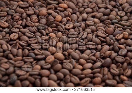 Roasted Coffee Beans Background. Arabica Pure Blend