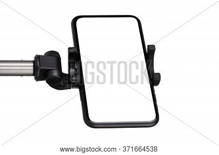 Smartphone With A White Cut-out Screen On A Monopod. Selfie Stick And Smartphone On A White Backgrou