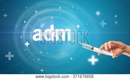 Syringe needle with virus vaccine and adm abbreviation, antidote concept