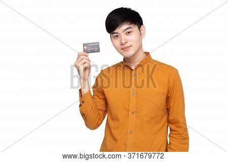 Young Asian Man Holding Credit Card Isolated On White Background