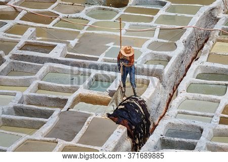 Unknown Woker In The Tannery In Fez, Morocco. The Tanning Industry In The City Is Considered One Of 