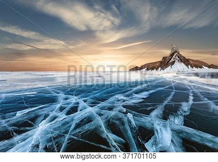 A Picturesque Frozen Lake On The Background Of A Snow Glacier.