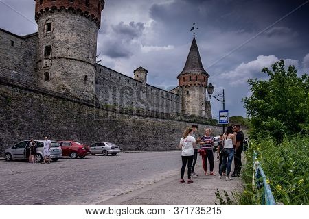 Kamyanets-podilskiy, Ukraine - June 11, 2020: Tour Group Near The Fortress In Kamyanets-podilskiy, U