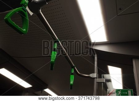 The Green Hanging Hand-rail In Public Transport.