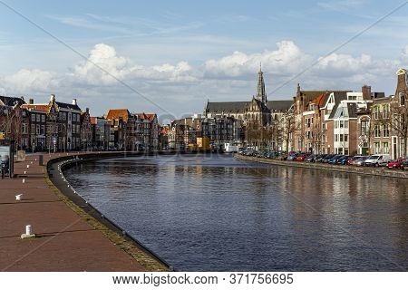 Canal View On The Haarlem And Bavo Church At The Center City Skyline Along The Canal, Netherlands