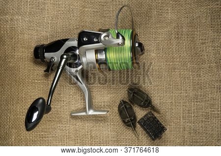 Fishing, Carp Reel With Fishing Linel On The Background Of Burlap . Burlap