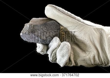 Miner Hand Holding Iron Stone, Metallic Iron Pyrite, Steel, Used In Heavy Industrial Production. Min