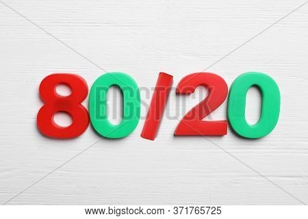 Colorful Numbers 80 And 20 On White Wooden Background, Flat Lay. Pareto Principle Concept