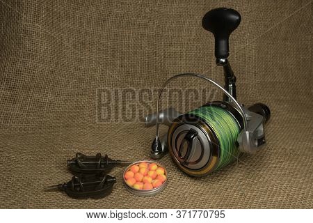 Fishing, Carp Reel With Fishing Linel On The Background Of Burlap . Burlap