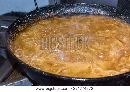 Cooking A Spanish Omelette On A Pan