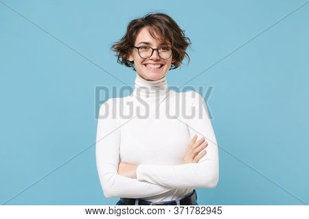 Smiling Young Brunette Woman Girl In Casual White Clothes, Eyeglasses Posing Isolated On Pastel Blue