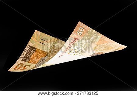 Fifty Reais Banknote Falling On White Background. Concept Of Light Money, Fortune, Grand Prize.