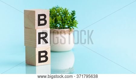 Brb - Big Red Button. Wooden Blocks With The Word Brb, Blu Bacground. High Level Of Business Profita