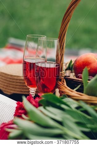 Mood Reading A Picnic Book Under A Glass Of Red Wine