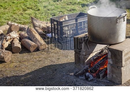 The Boiler On The Fire. Cooking On An Open Fire. Hearth With Wood For Boiling Water. Summer Picnic. 