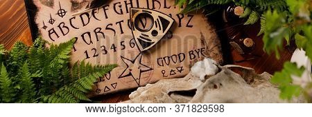 Mystic Ritual With Ouija And Candles. Devil's Board Concept, Black Magic Or Fortune Telling Rite Wit