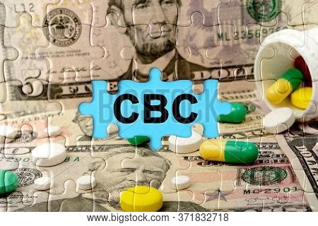 Double Exposure. Puzzles Depicting Pills And Dollars With The Inscription -cbc. The Concept Of Medic