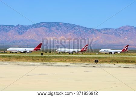 June 10, 2020 In Mojave, Ca:  Row Of Retired Qantas Airlines 747 Aircraft Ready To Be Resold Or Dism