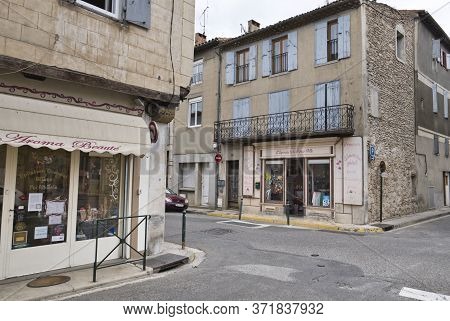 Limoux, Aude, France 06/16/20 Cross Roads With Shops At The Intersection. Old Town Buildings With Sh
